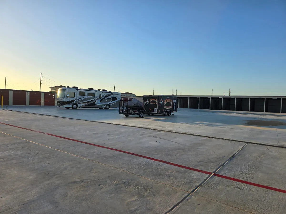 Concrete slab with a parked trailer and RV